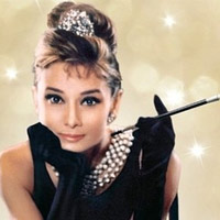 Audrey Hepburn helped popularize the high-bosomed, sleeveless dress in 1962